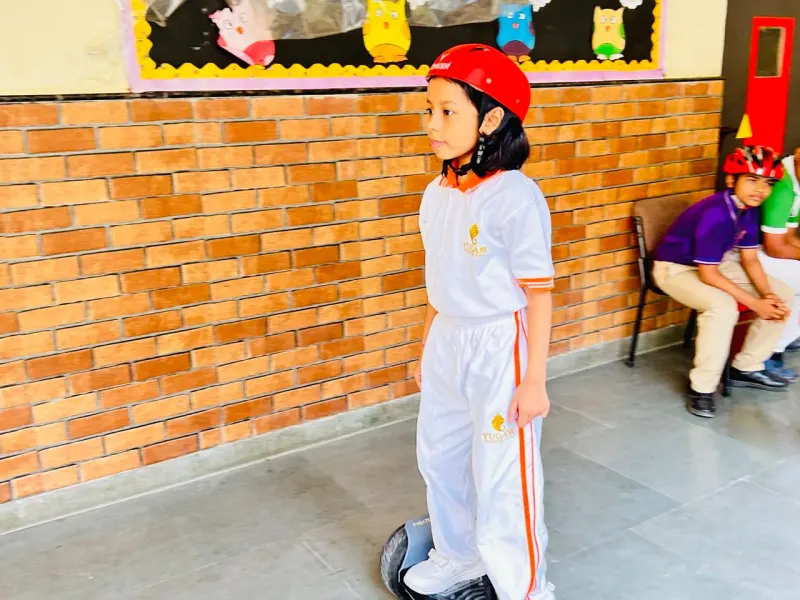 Student balancing on a hoverboard activity