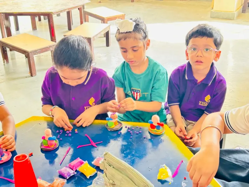 Students working on clay and craft