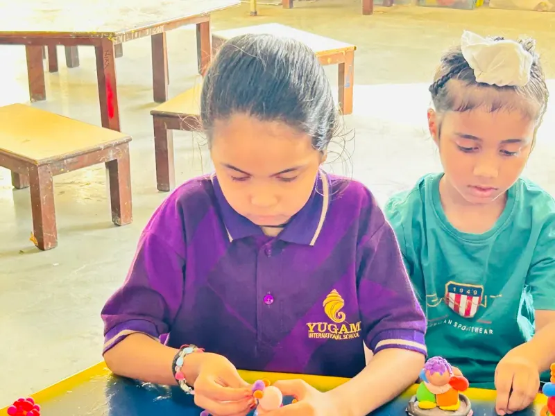 A student focused on an art activity
