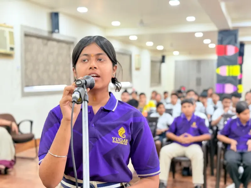 Student addressing peers during a Samvaad session